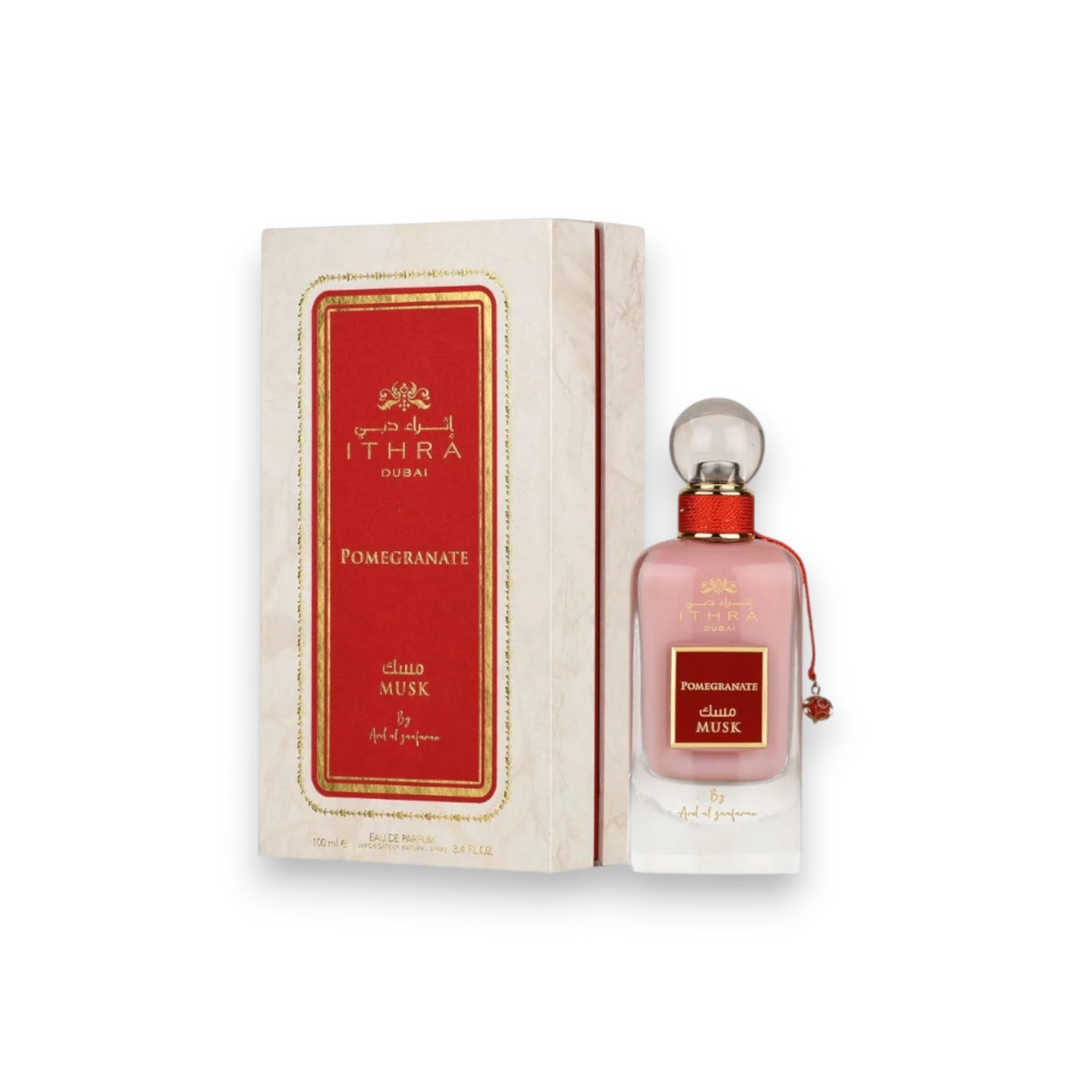 pomegranate Ithra musk perfume bottle and box on a white background