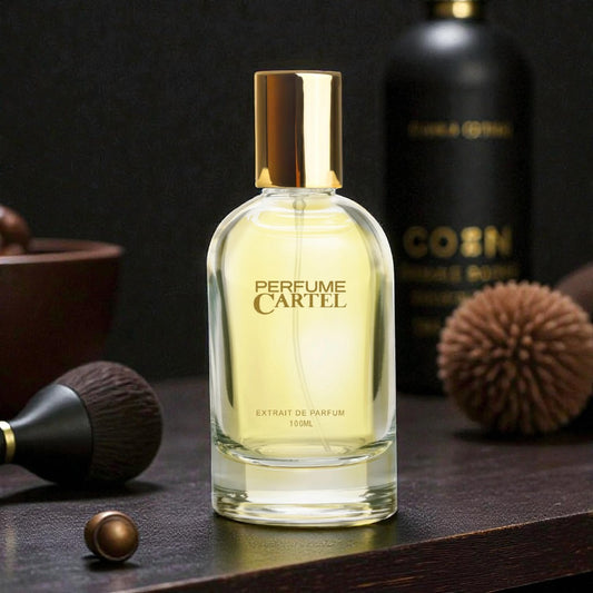 Perfume Cartel bottle on a dark surface with decorative items