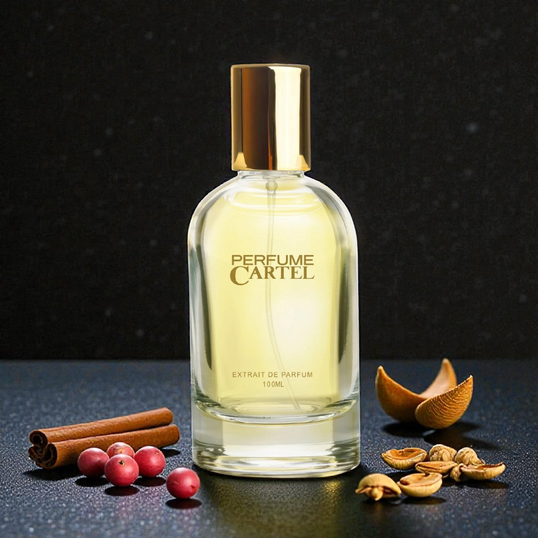 Perfume Cartel bottle with cinnamon sticks, berries, and nuts on a dark background