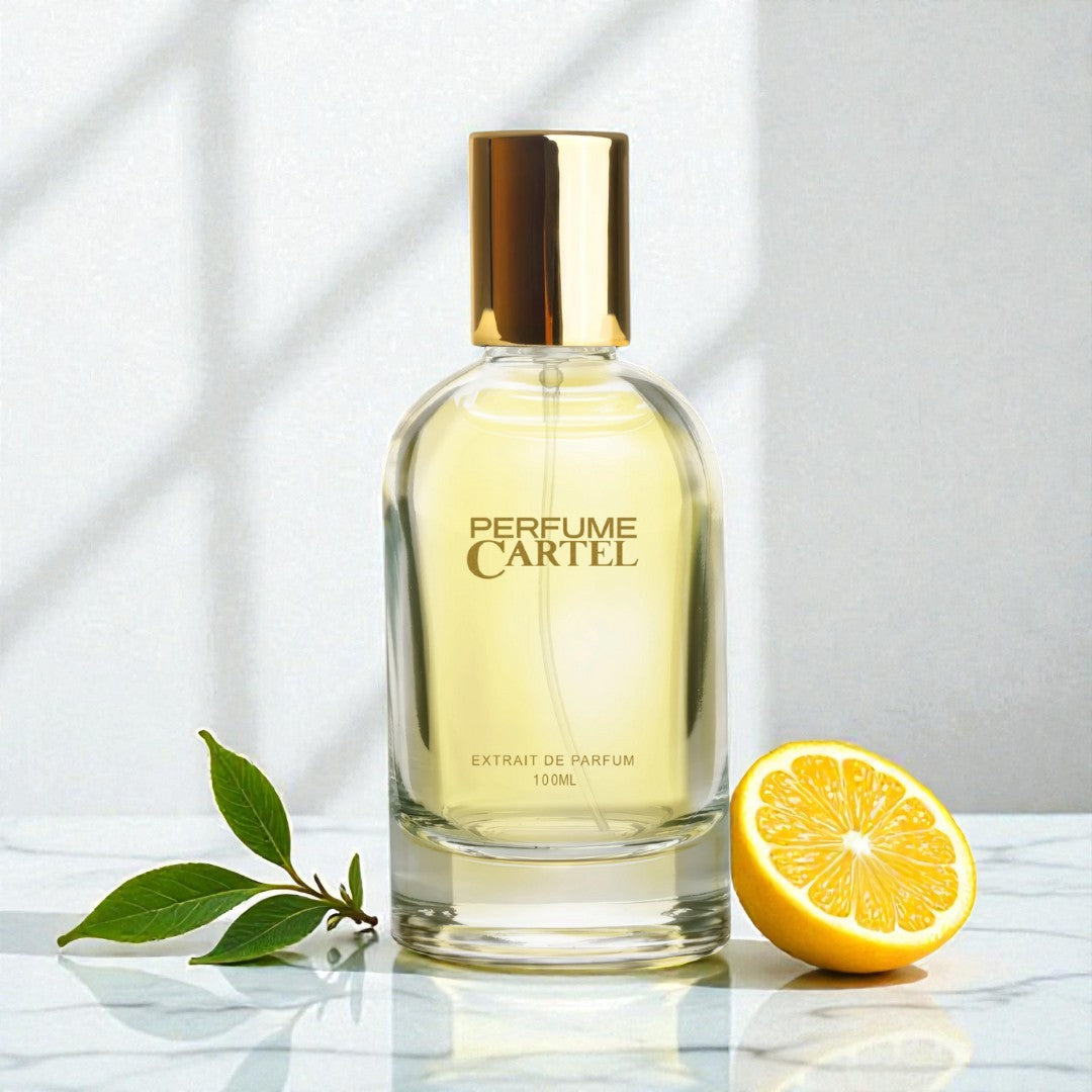 Perfume Cartel bottle with a lemon and leaves on a light background
