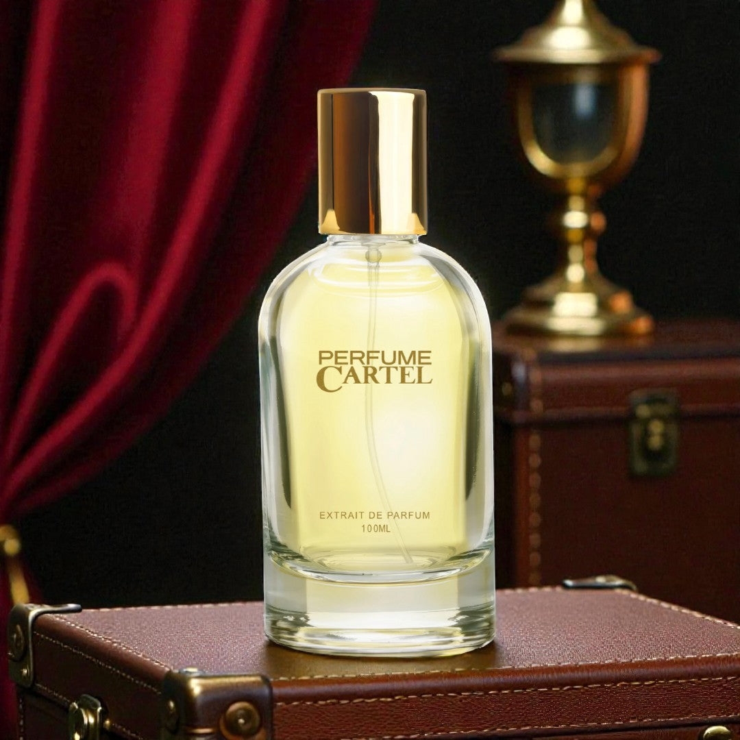 Perfume Cartel bottle on a vintage suitcase with a dark background