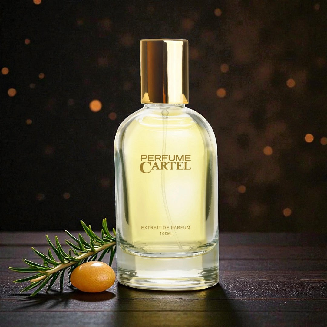Perfume Cartel bottle with a gold cap on a dark background