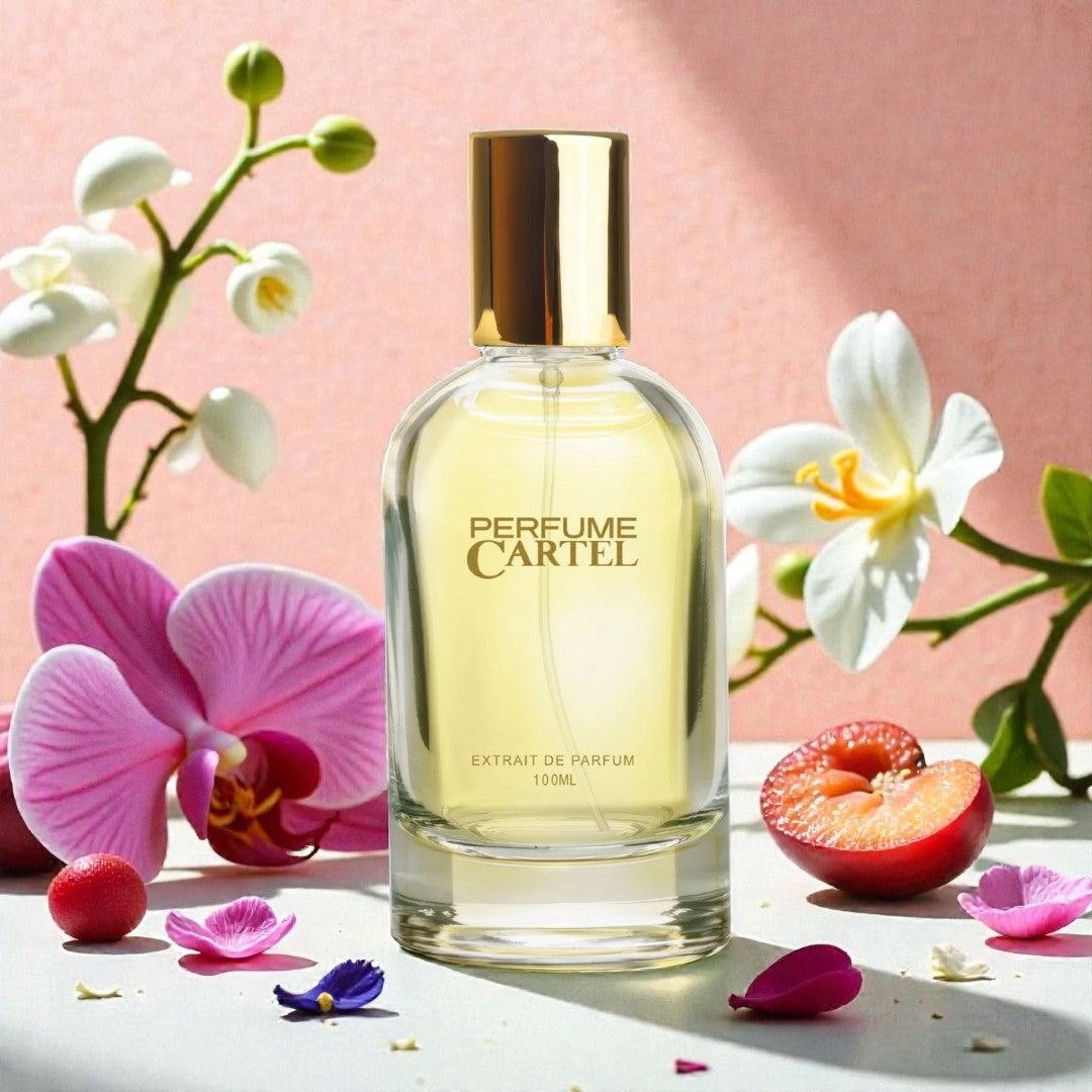 Perfume Cartel bottle with flowers and fruits on a pink background