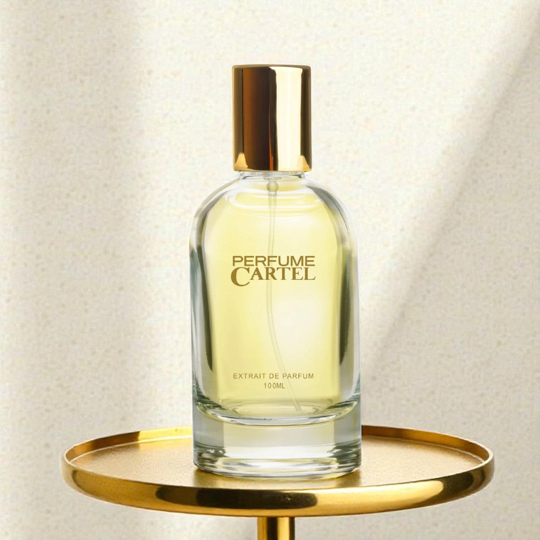 Perfume Cartel bottle on a gold tray with a light background