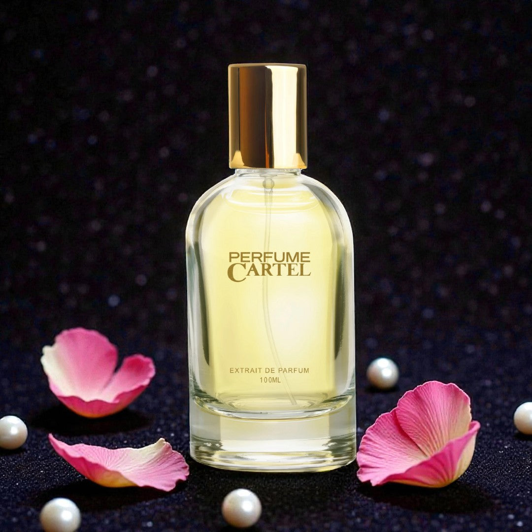 Perfume Cartel bottle with pink petals and pearls on a dark background