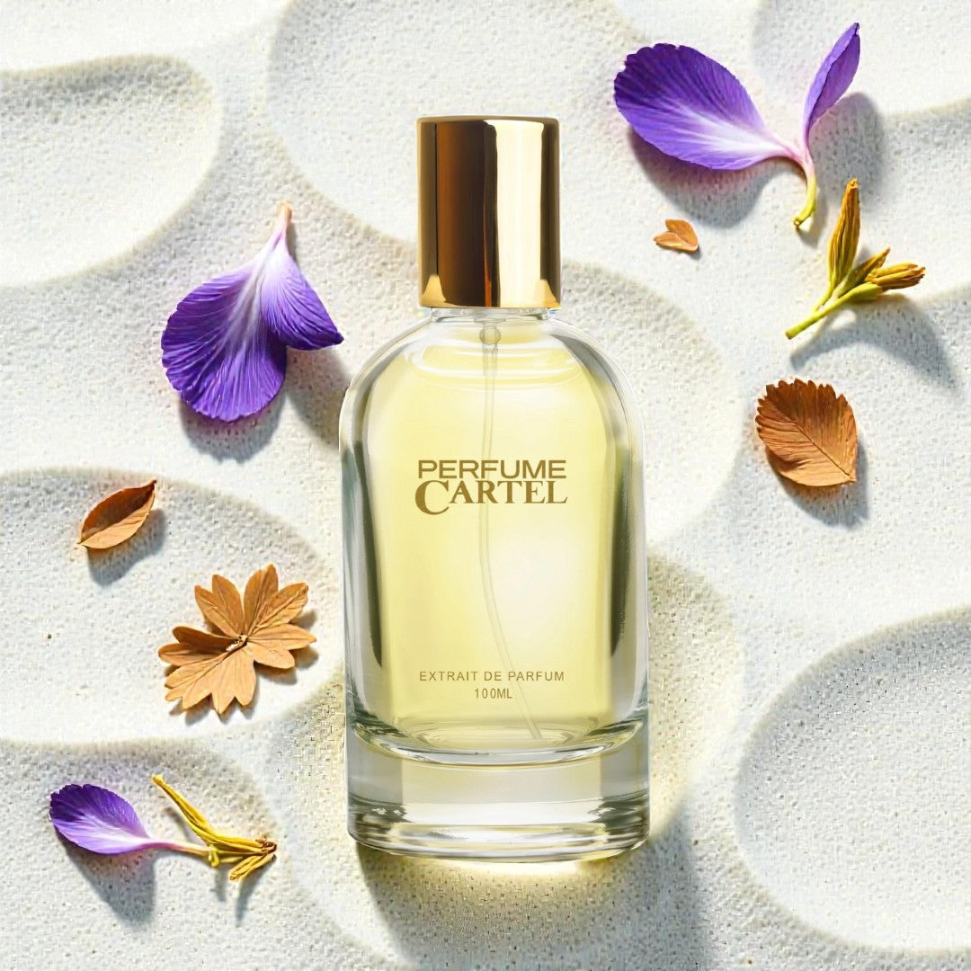 Perfume Cartel bottle with flowers on a textured surface