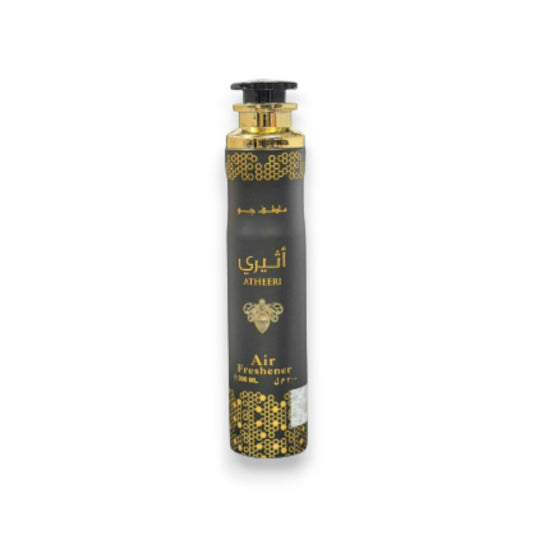 Black and gold air freshener bottle on a white background