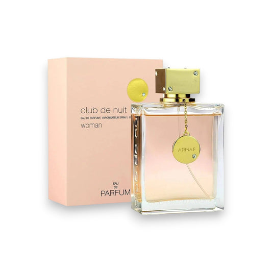 Perfume bottle and packaging of 'club de nuit woman' on a white background