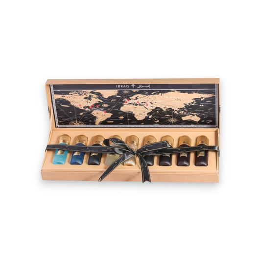 Set of perfume bottles in a wooden box with a world map design on a white background
