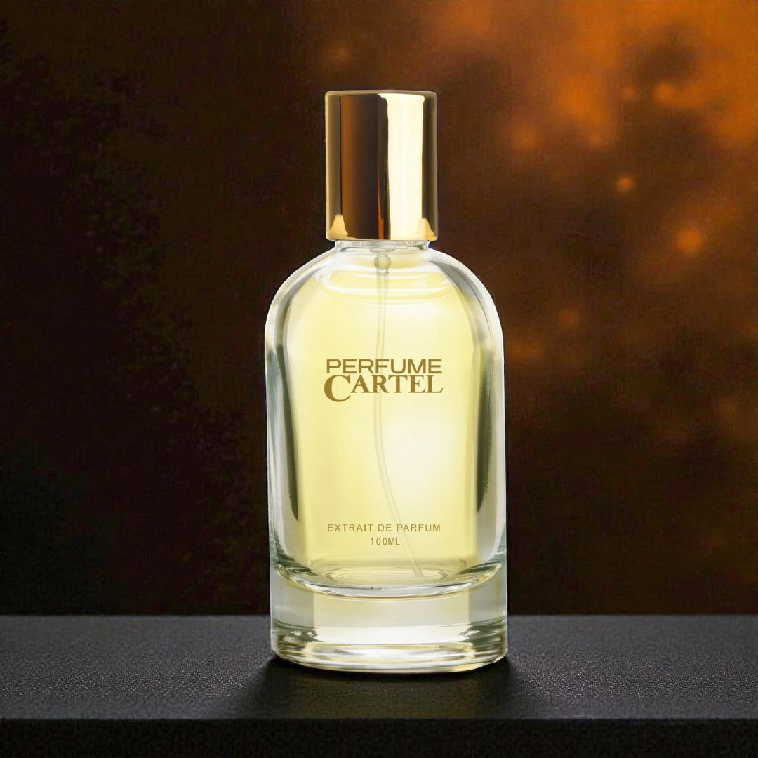 Perfume Cartel bottle on a dark surface with a warm background
