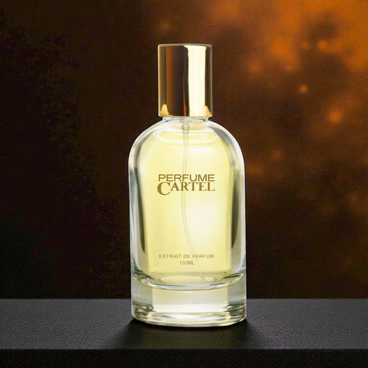 Perfume Cartel bottle on a dark surface with a warm background
