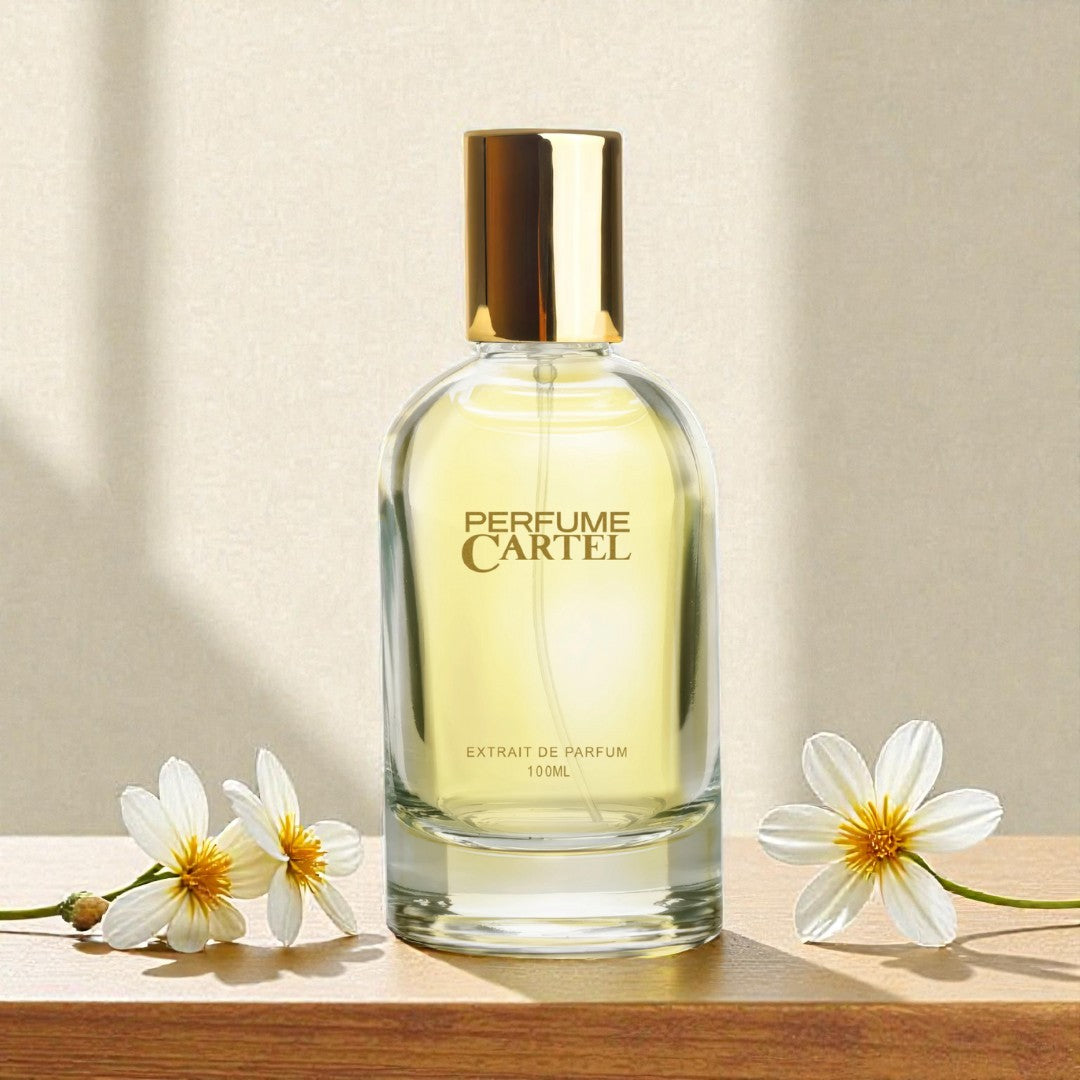 Perfume Cartel bottle with flowers on a wooden surface