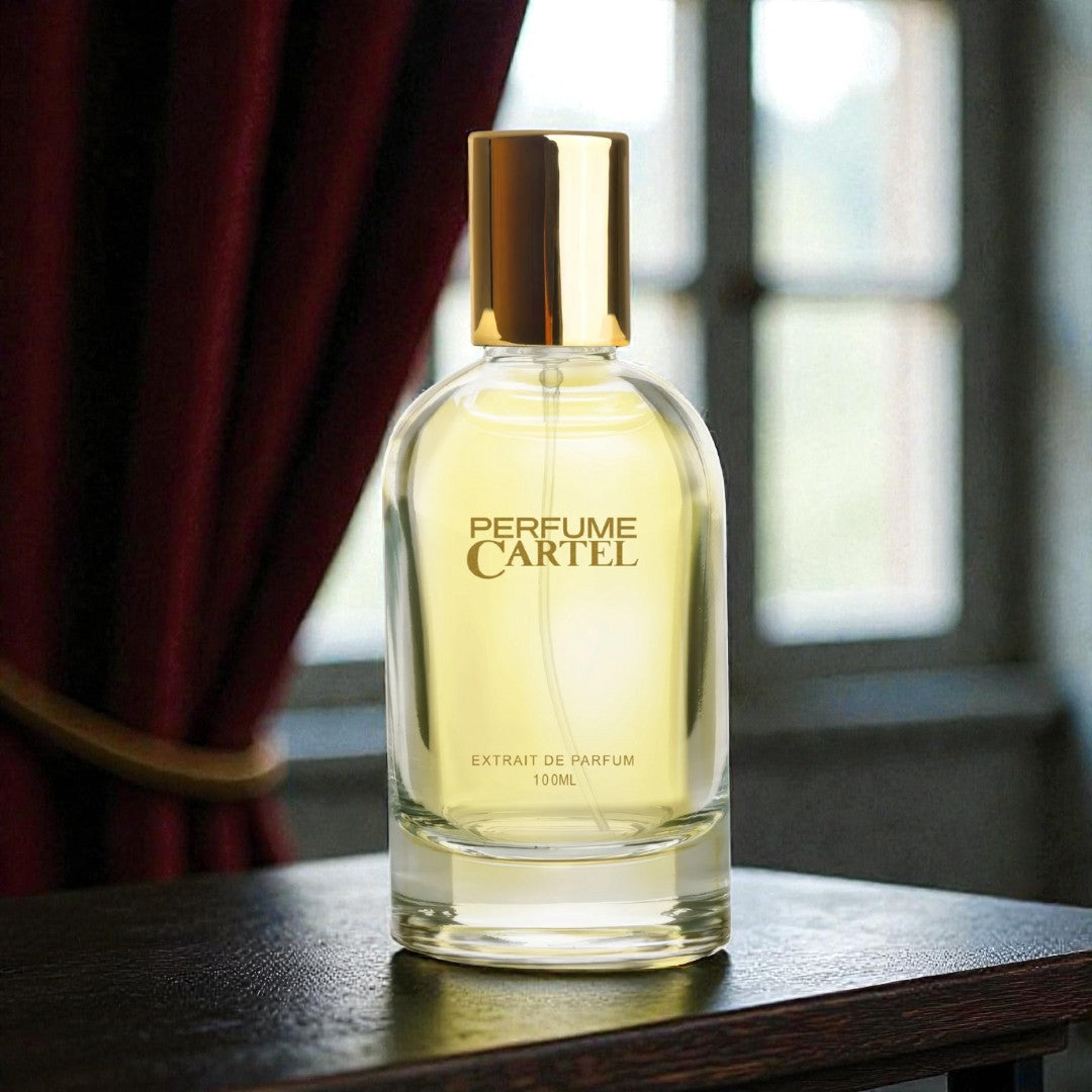 Perfume Cartel bottle on a wooden surface with a blurred background