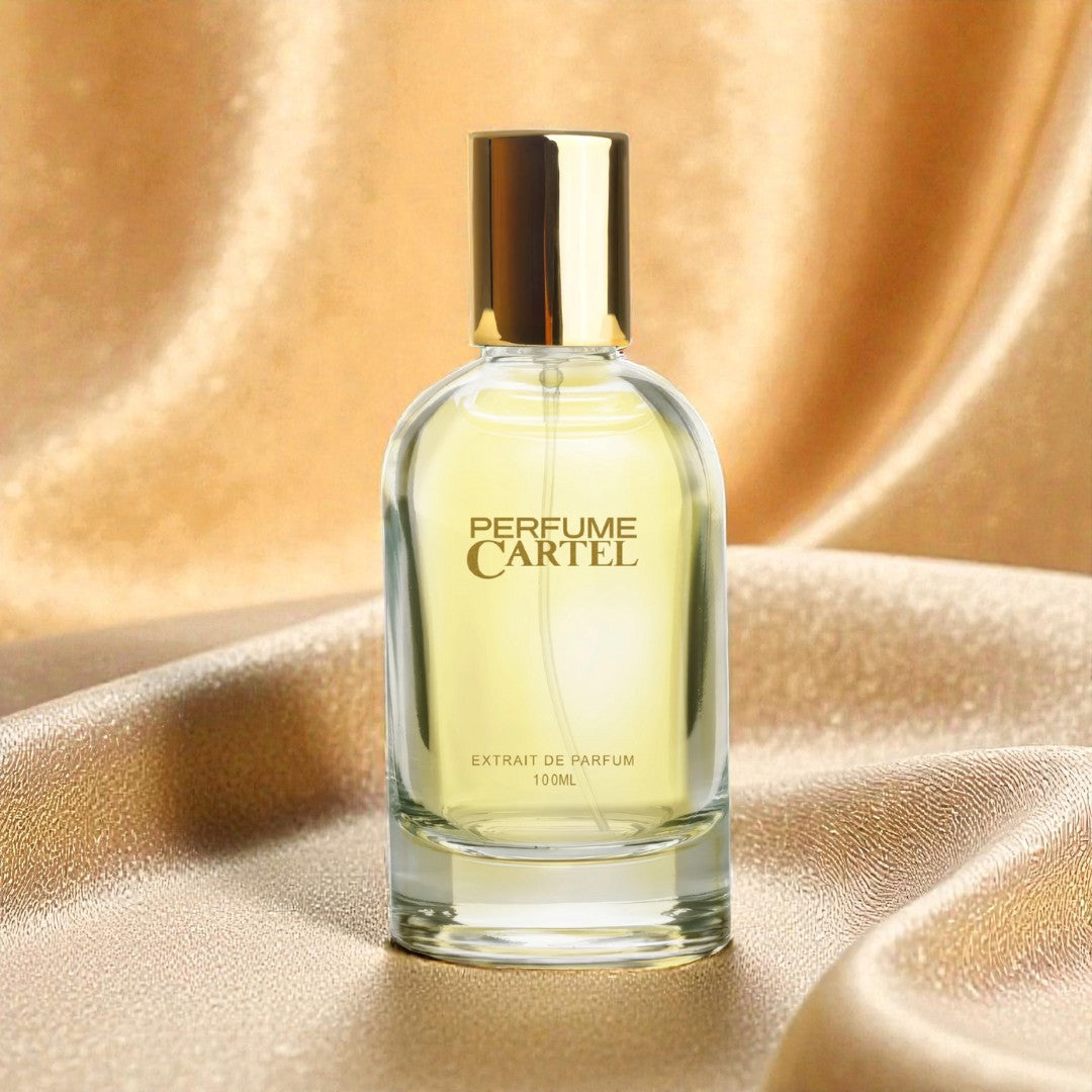 Perfume Cartel bottle on a gold fabric background