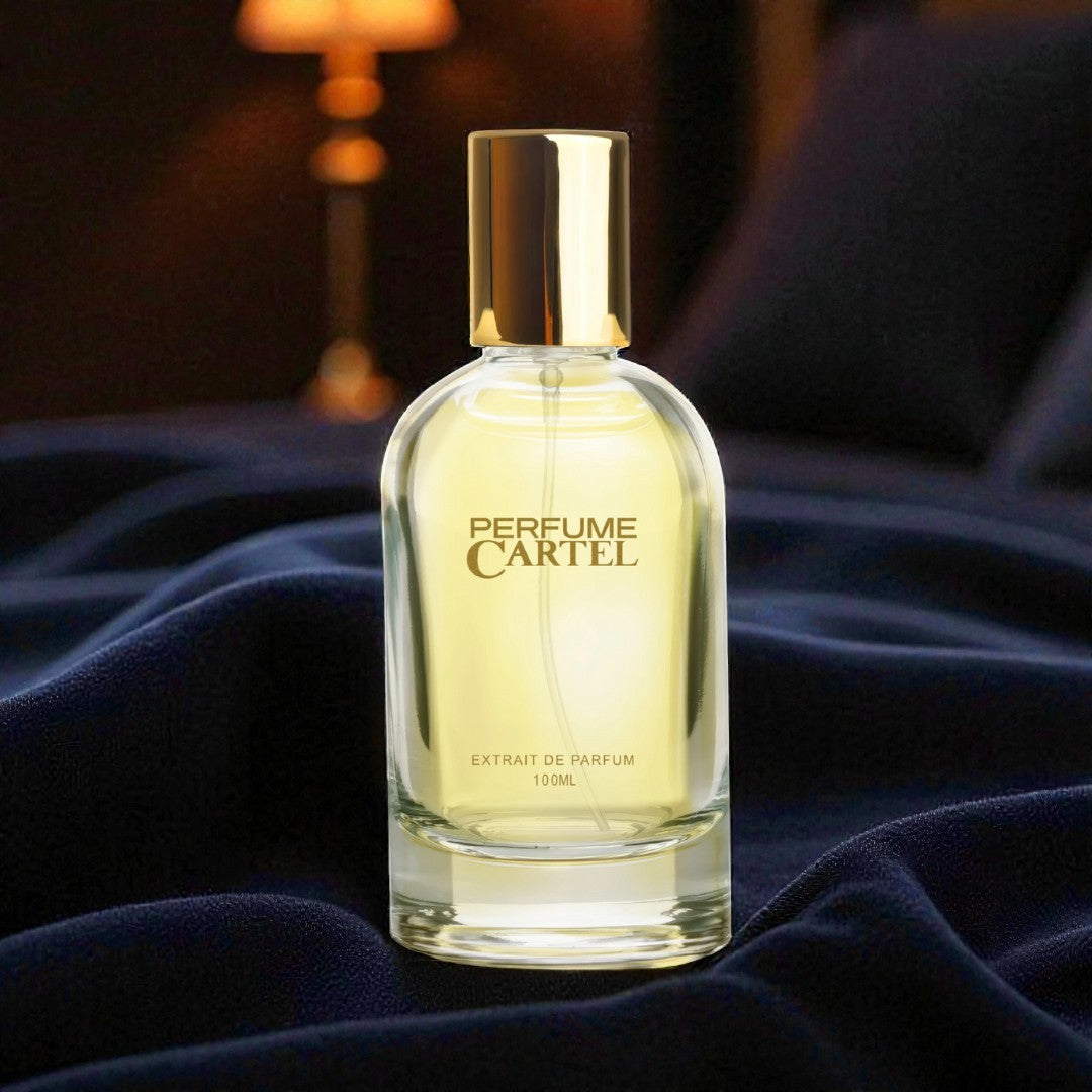 Perfume Cartel bottle on a dark fabric background