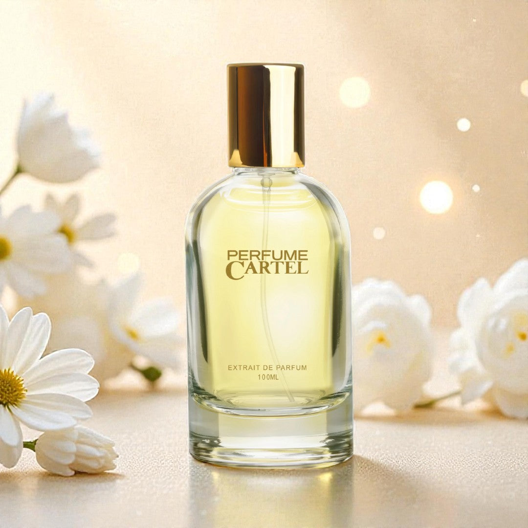 Perfume Cartel bottle with white flowers on a soft background